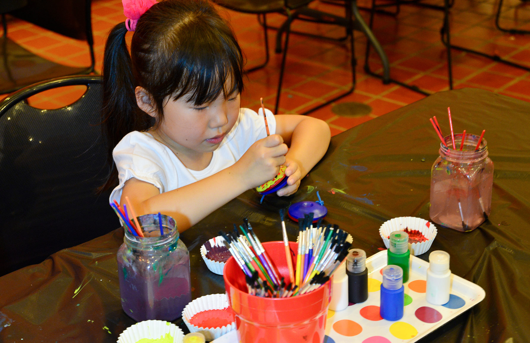 Young girl painting.