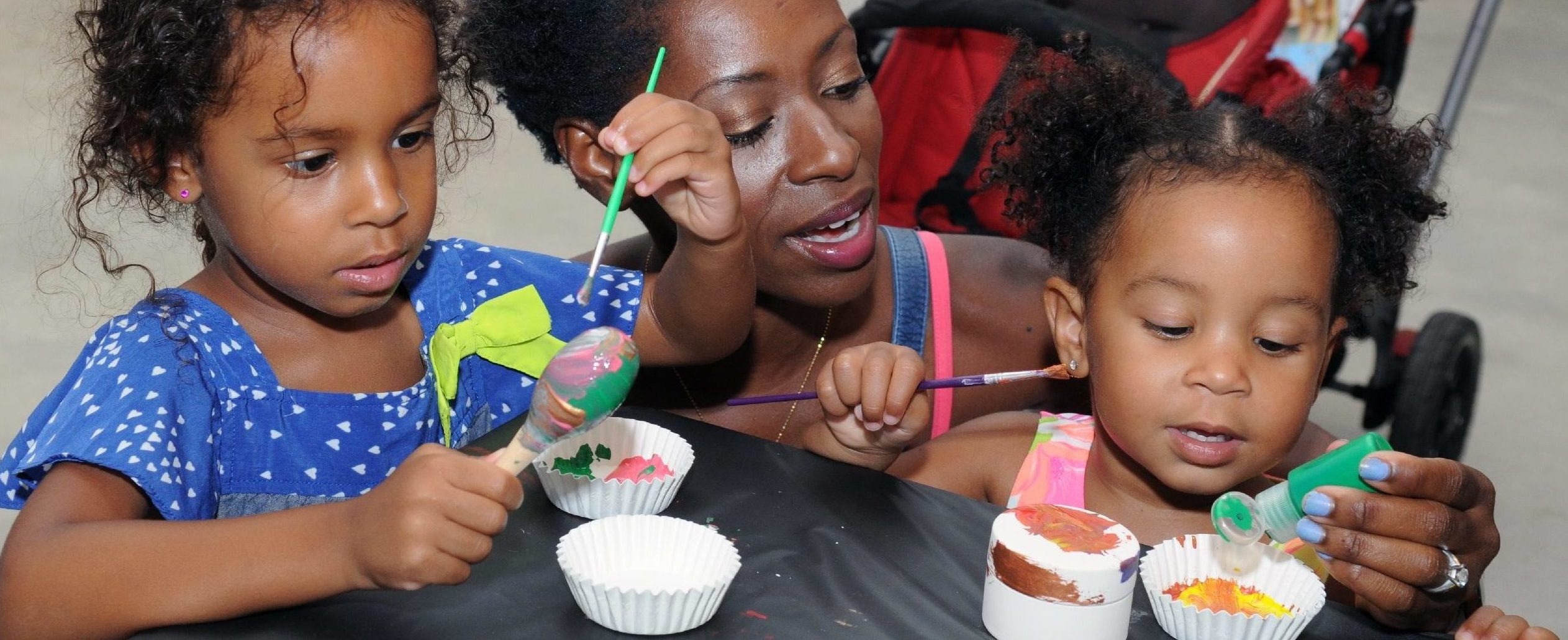 children painting with mom