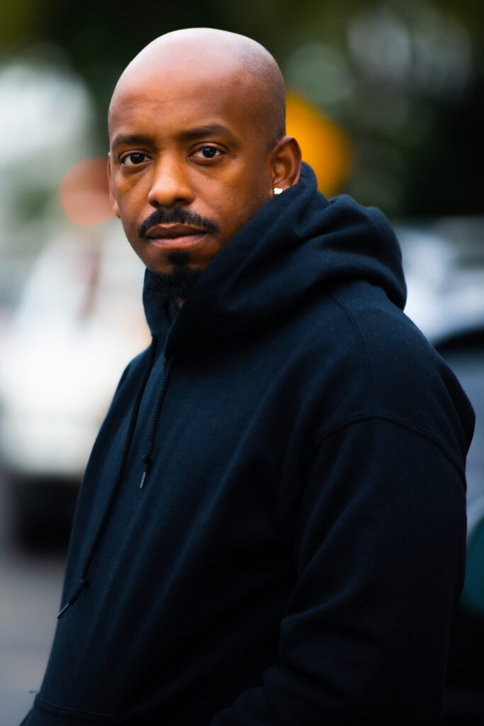 Rahsaan "FLY GUY" Alexander with blurred background