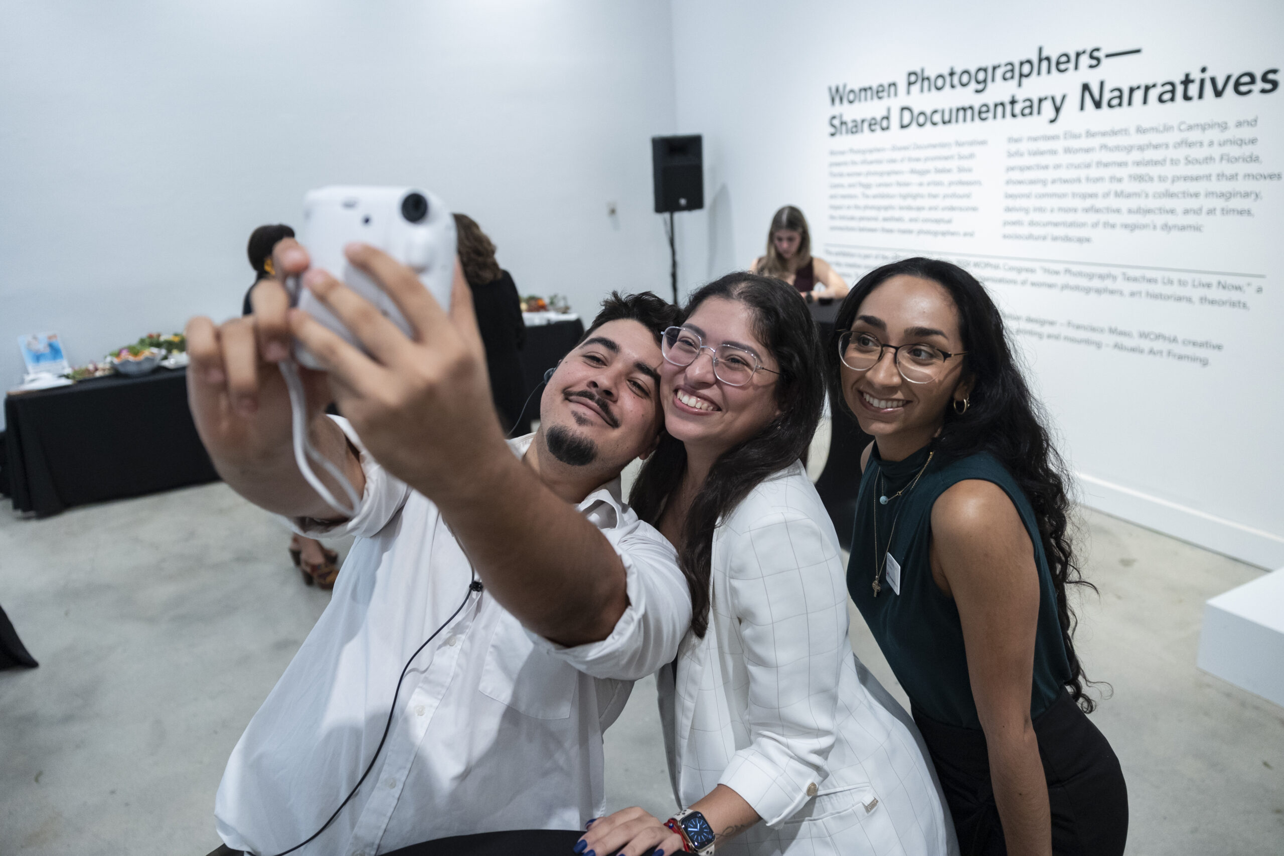 Member showing a child the museum exhibition