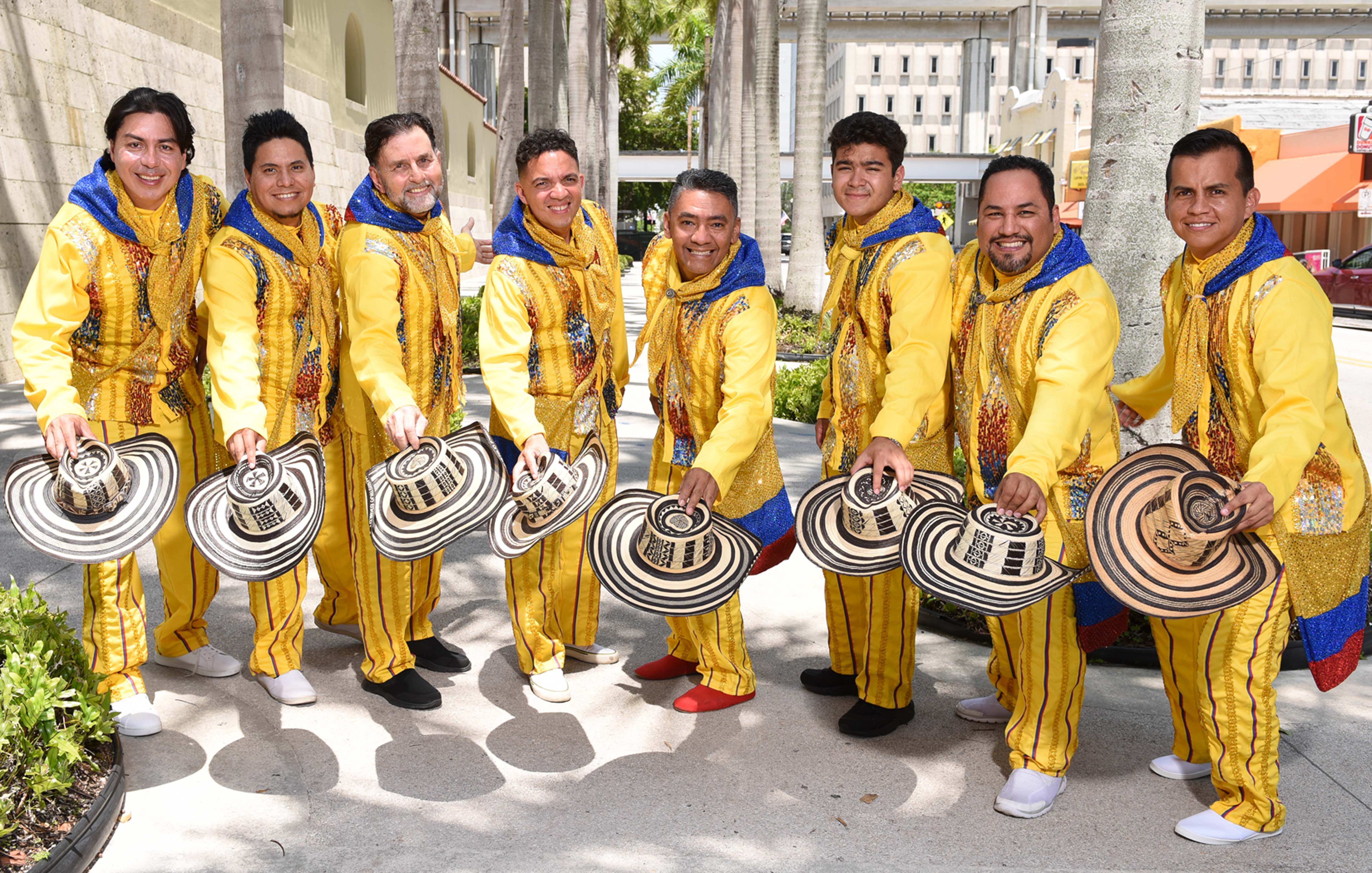men in yellow suits with sombreros