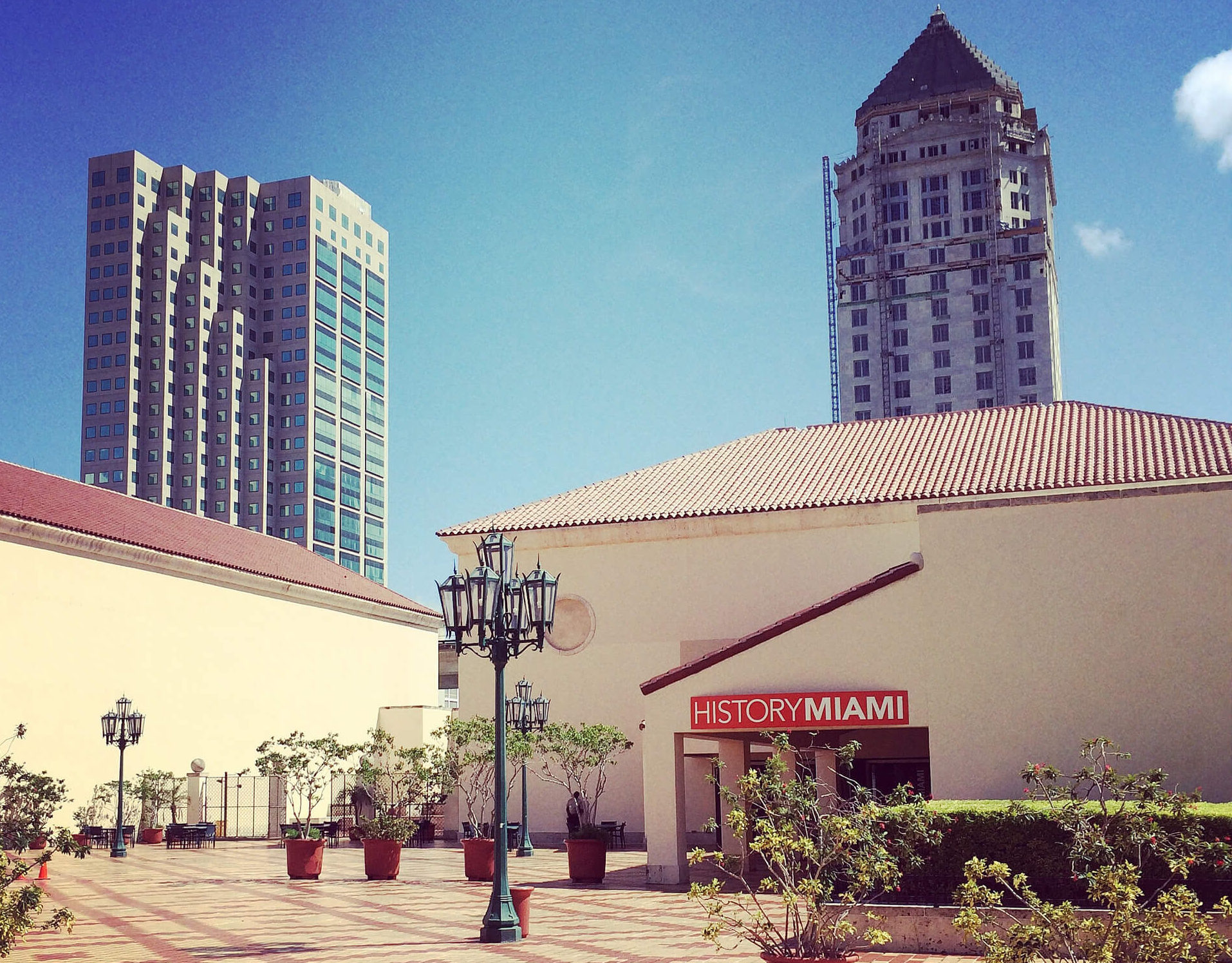 Exterior view of HistoryMiami Museum from the Cultural Center plaza. The courthouse is visible in the background.
