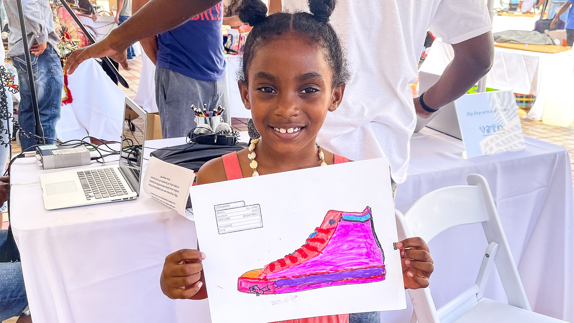 Girl holding drawing