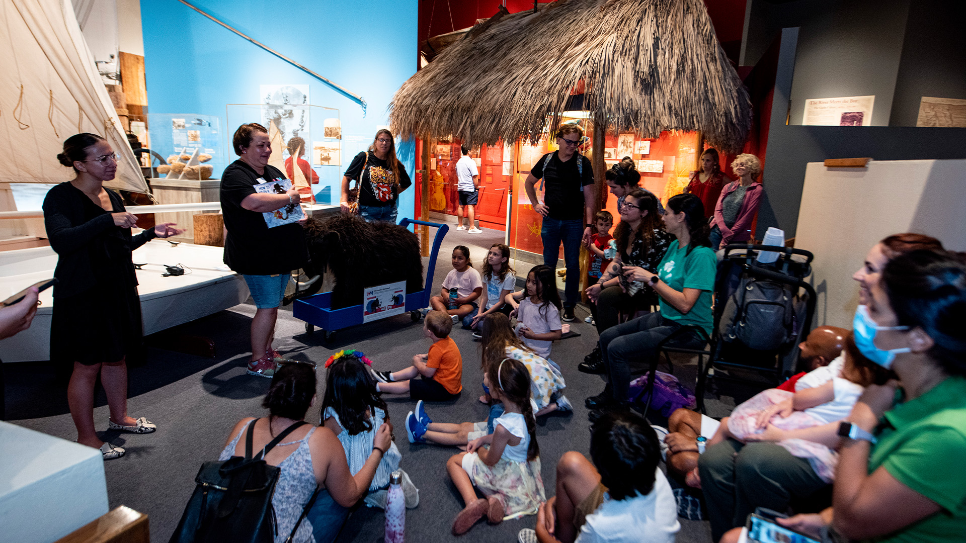 Person reading to children.