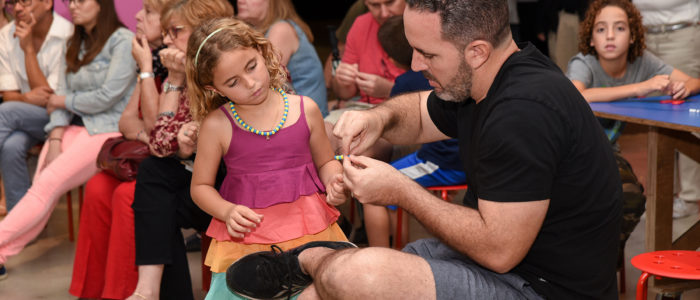 white man and white daughter doing craft