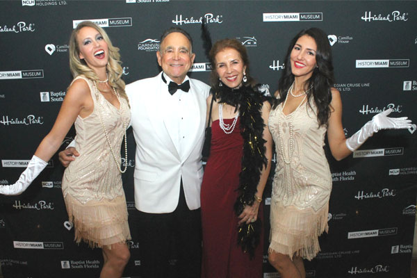 Members posing for photo in 1920s costume at the Flamingo Ball gala